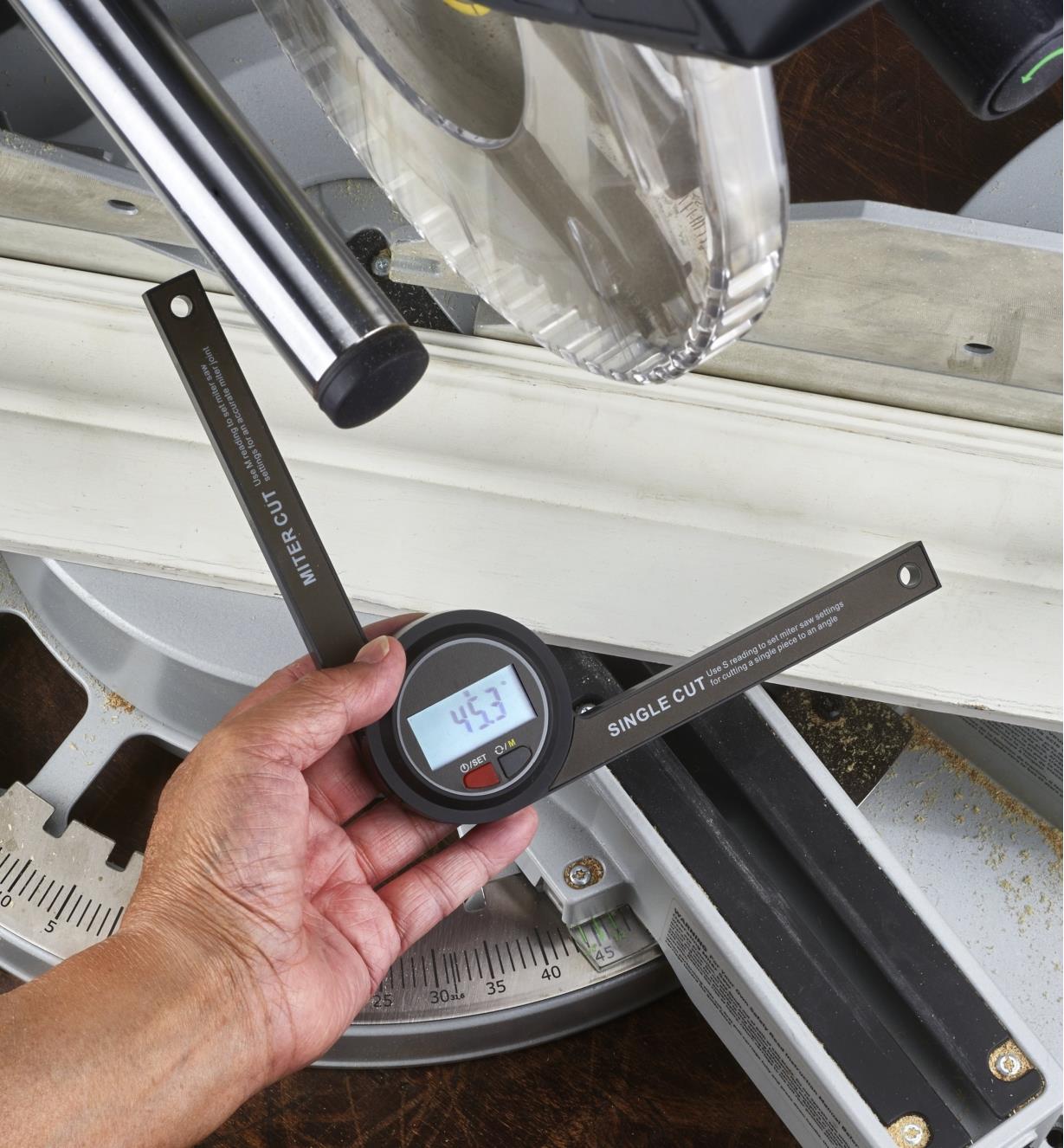 Using a digital miter saw gauge to transfer a measurement to the saw