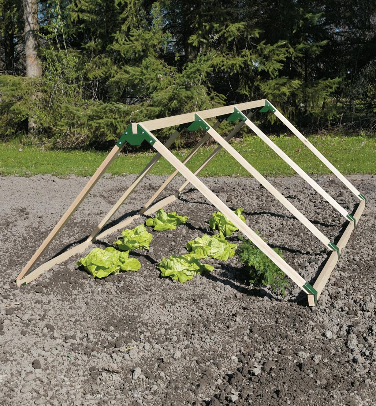 Garden-frame bracket sets used to create a triangular structure over a garden bed