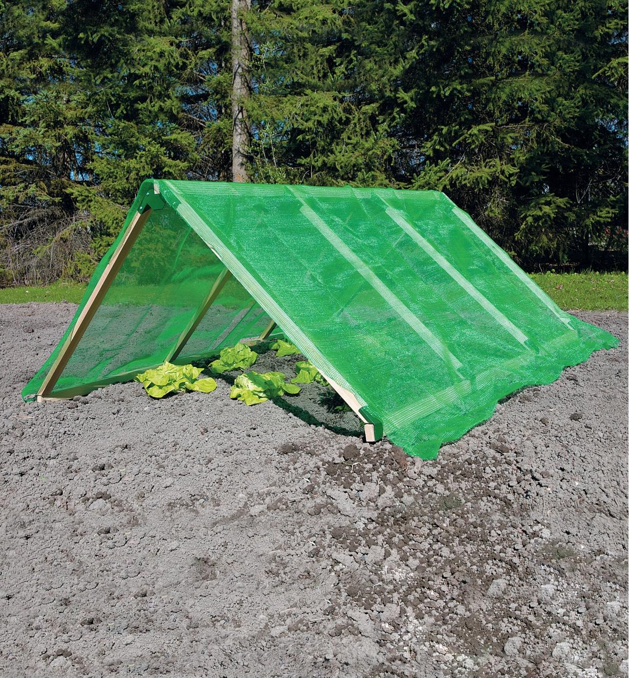 Garden-frame bracket sets used to create a shade-cloth covered triangular structure over a garden bed
