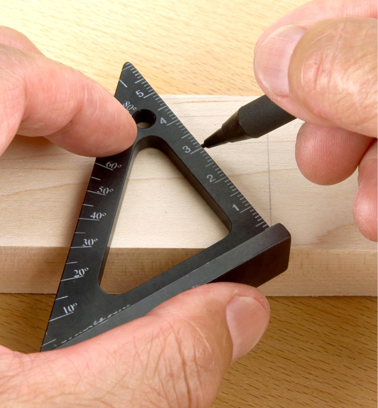Using the protractor scale marked on a Veritas 60mm Pocket Layout Square to lay out a 30° cut line