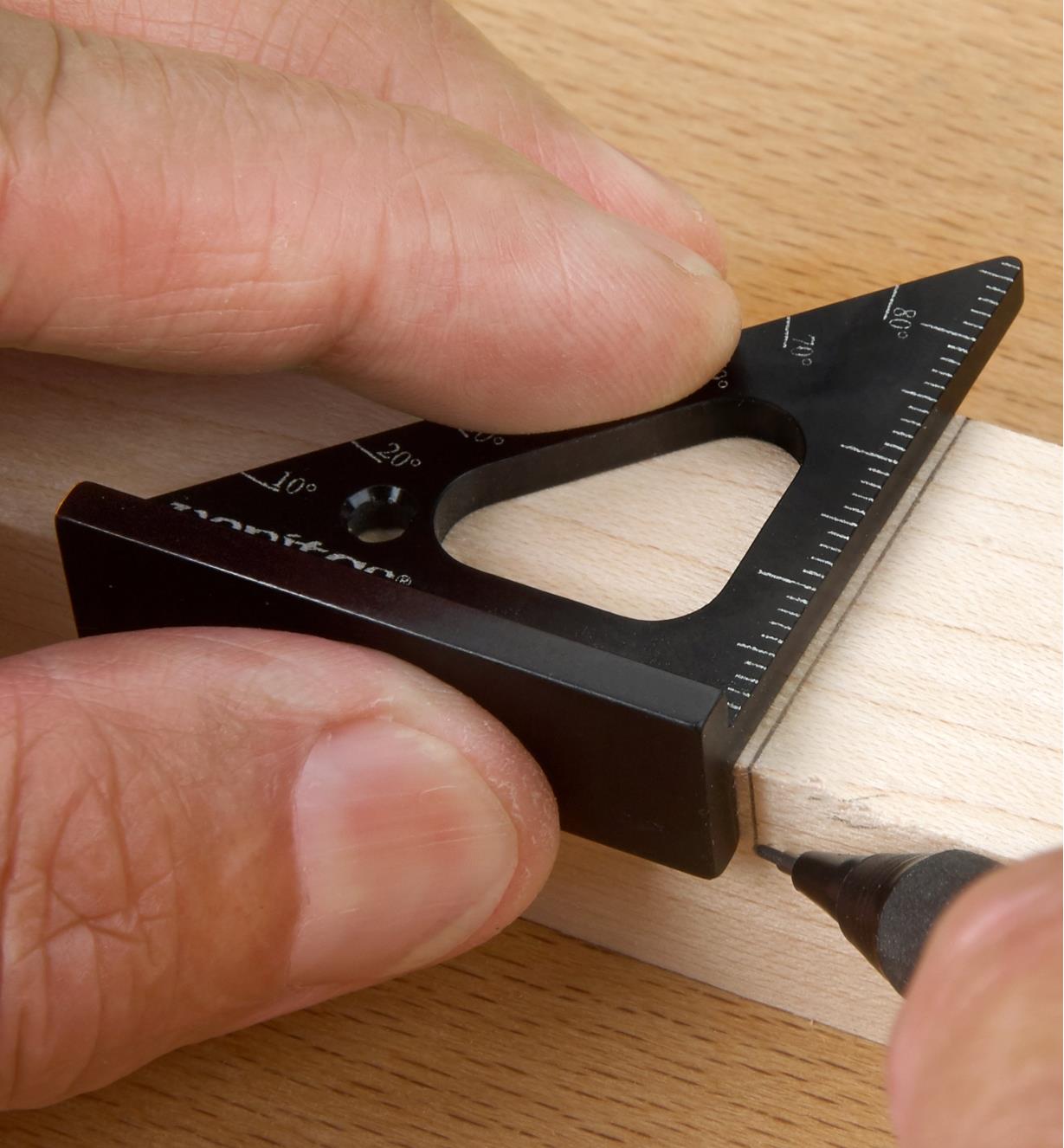 Registering a Veritas 35mm Pocket Layout Square against a workpiece edge while marking a cut line