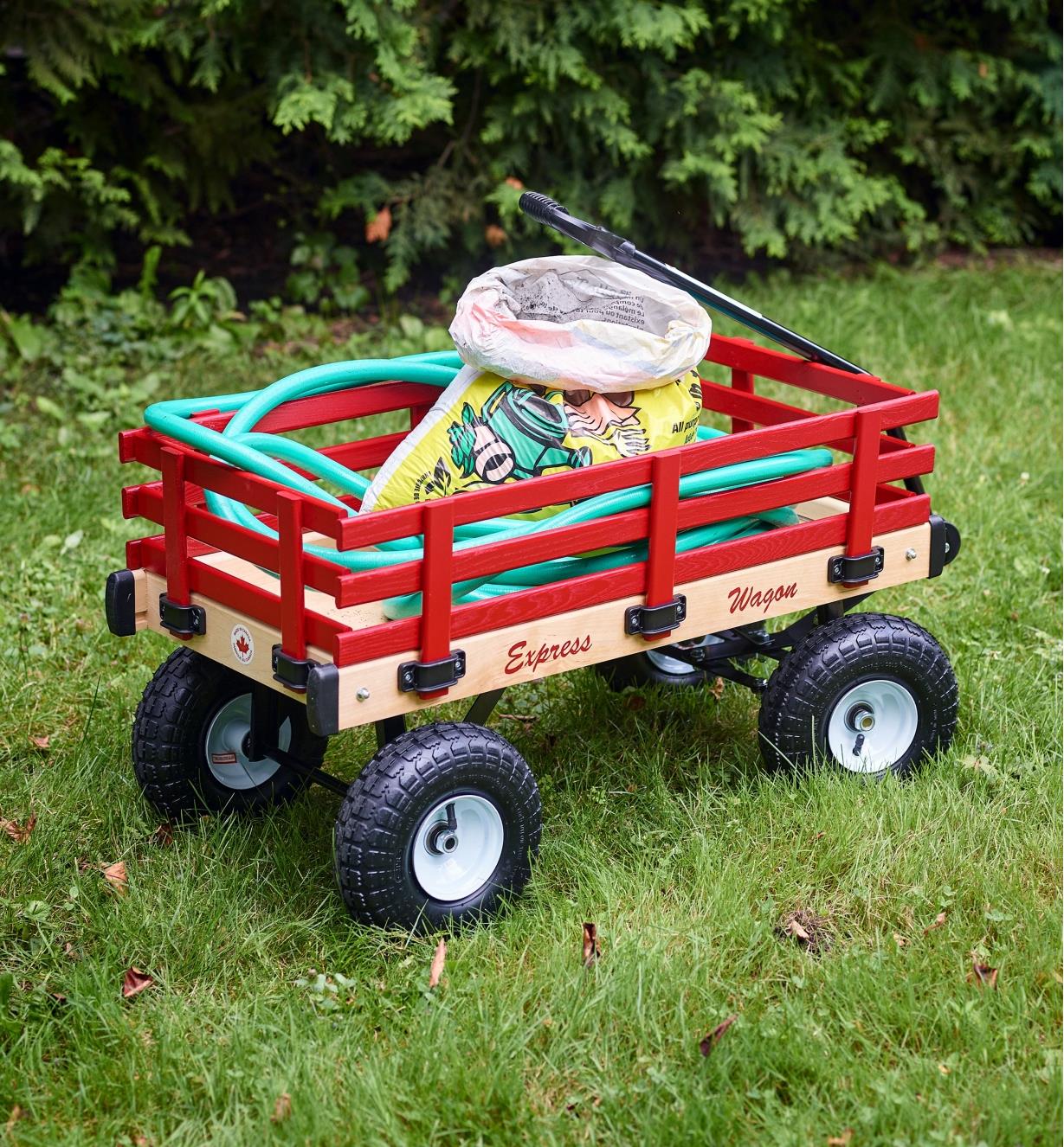 A wagon in a yard carrying gardening supplies