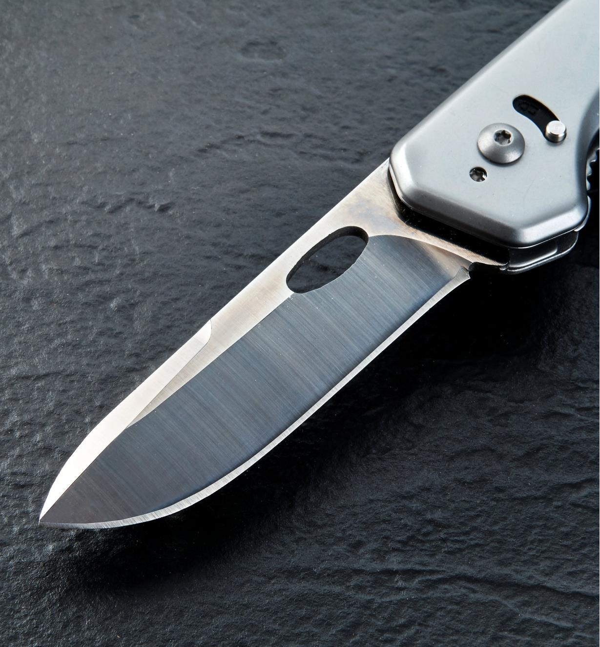 A close view of the included drop-point blade mounted on the 3-in-1 knife