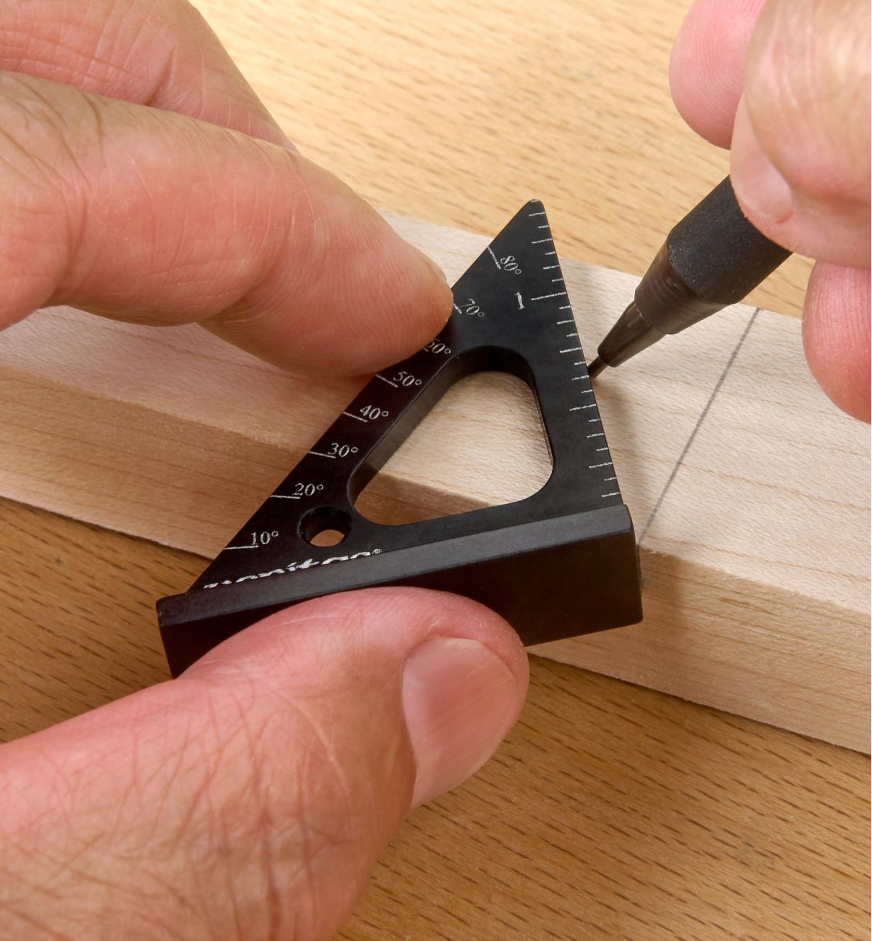 Using the protractor scale marked on a 1 1/2"" Pocket Layout Square to lay out an angled cut line
