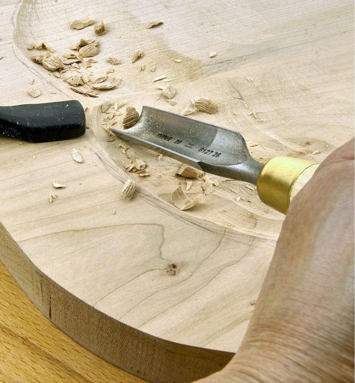 Using a 26mm firmer gouge to saddle a wooden chair seat