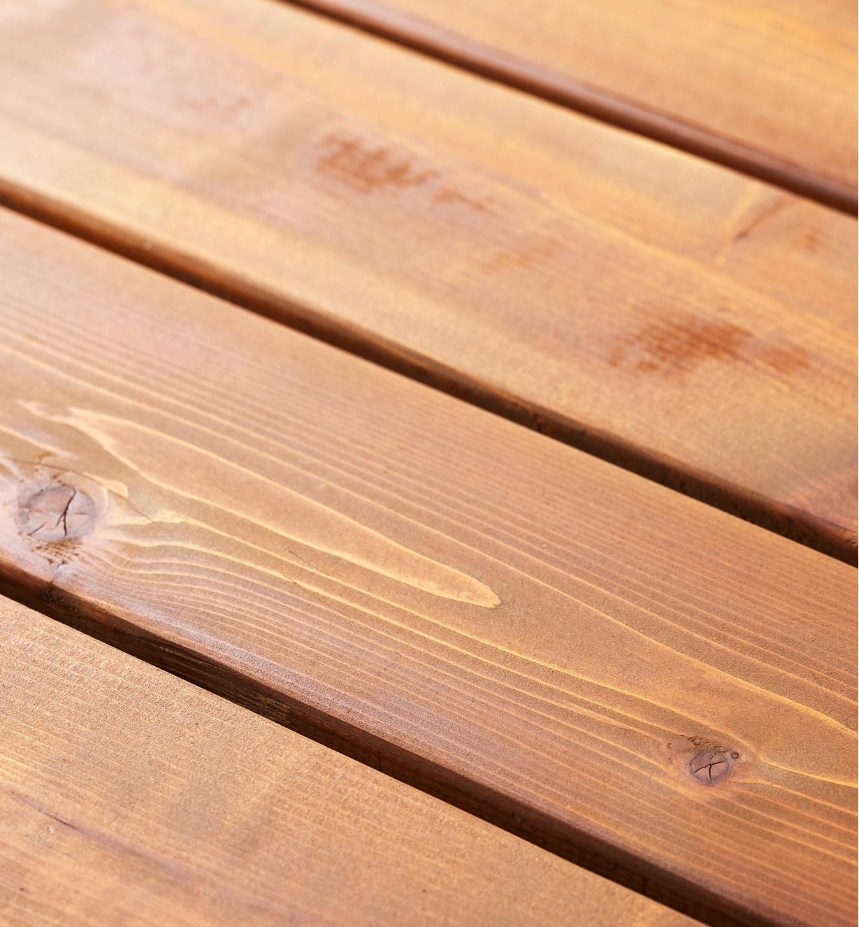Wooden deck boards finished with Osmo thermowood decking oil
