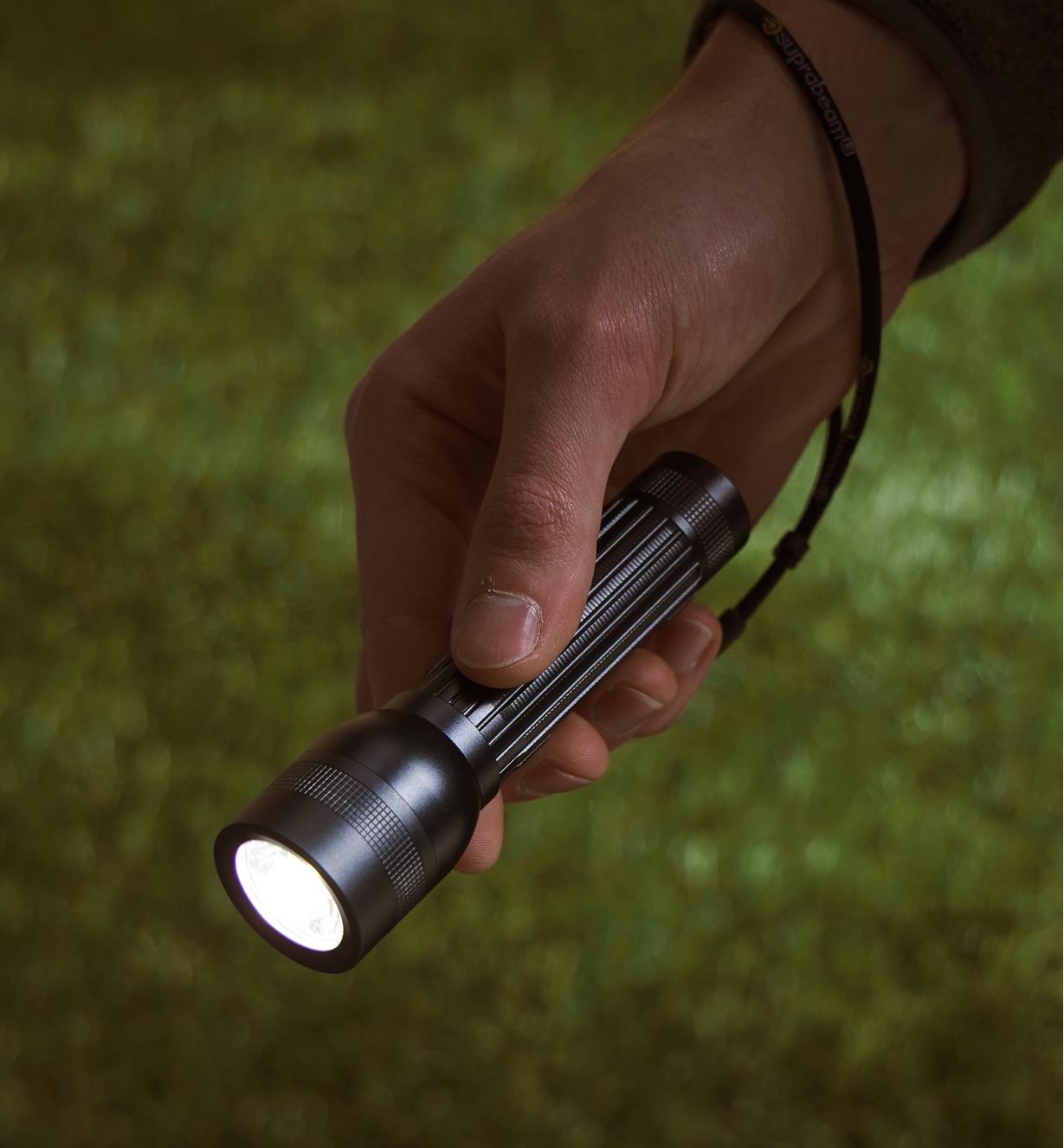Carrying a flashlight in the darkness