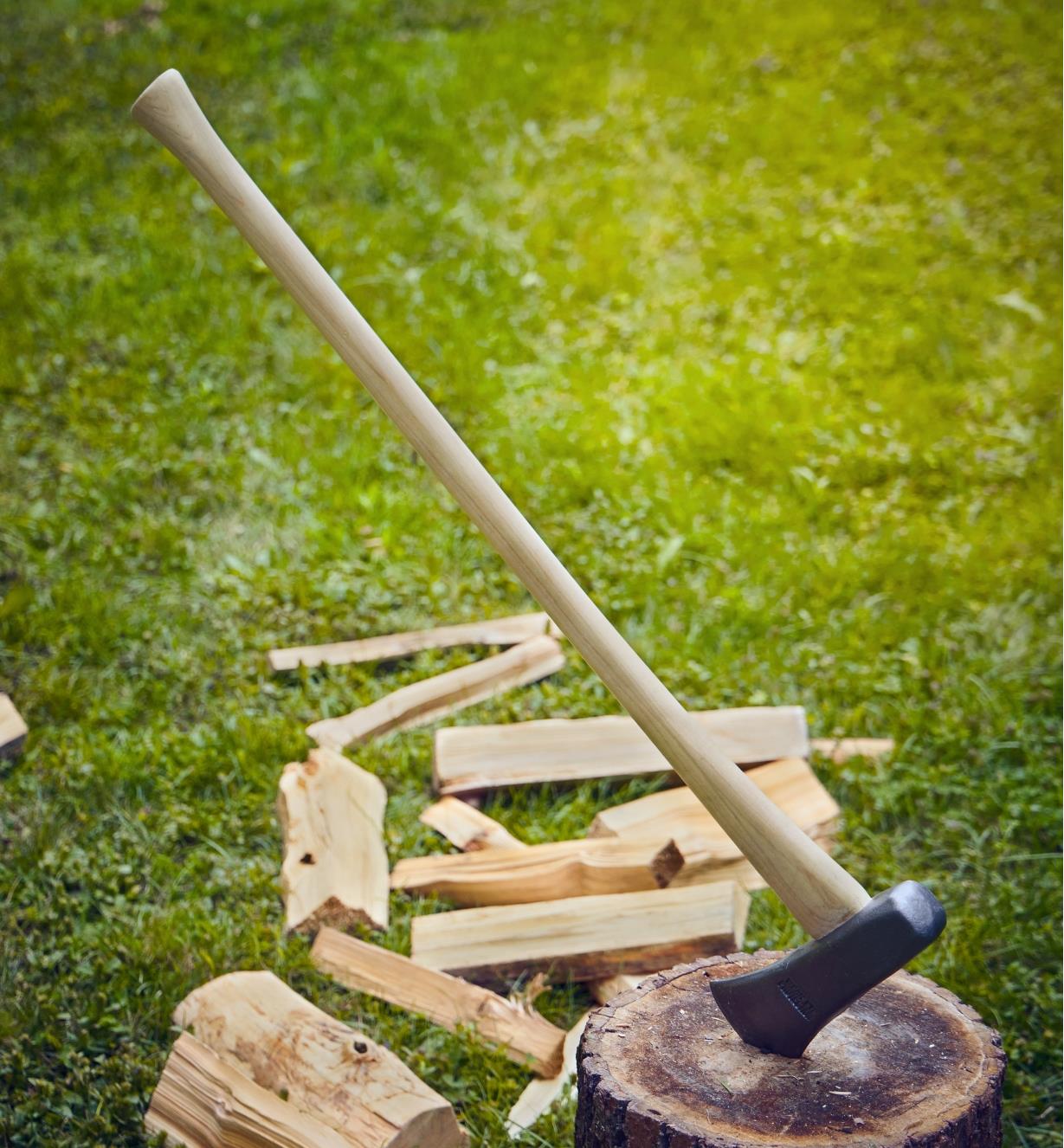 A maul embedded in a wood chopping block