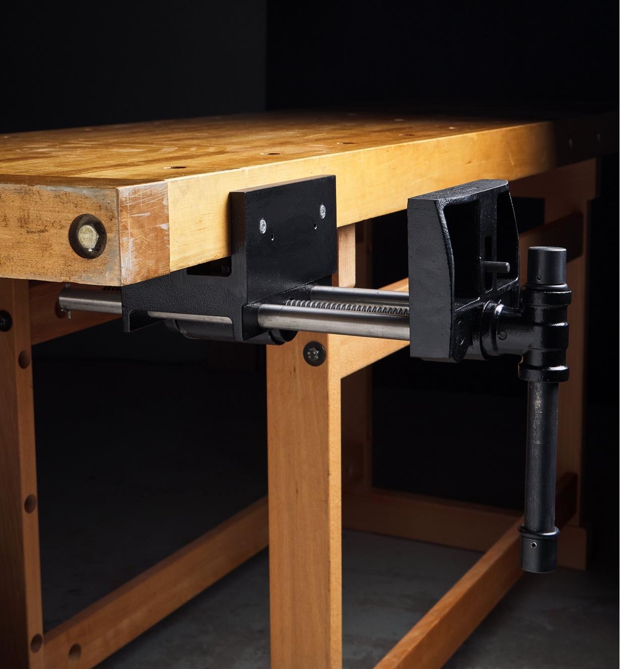 A side view of a Jorgensen quick-release bench vise installed on a workbench
