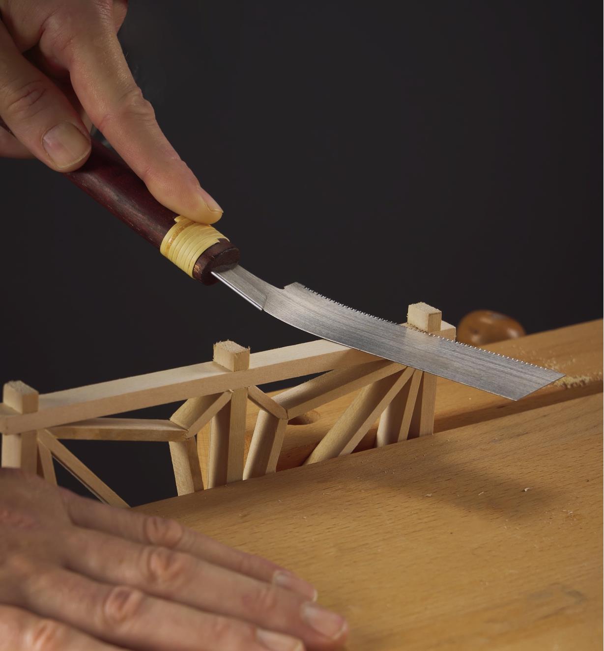 Using a Japanese kugihiki saw to flush-trim a wooden projection