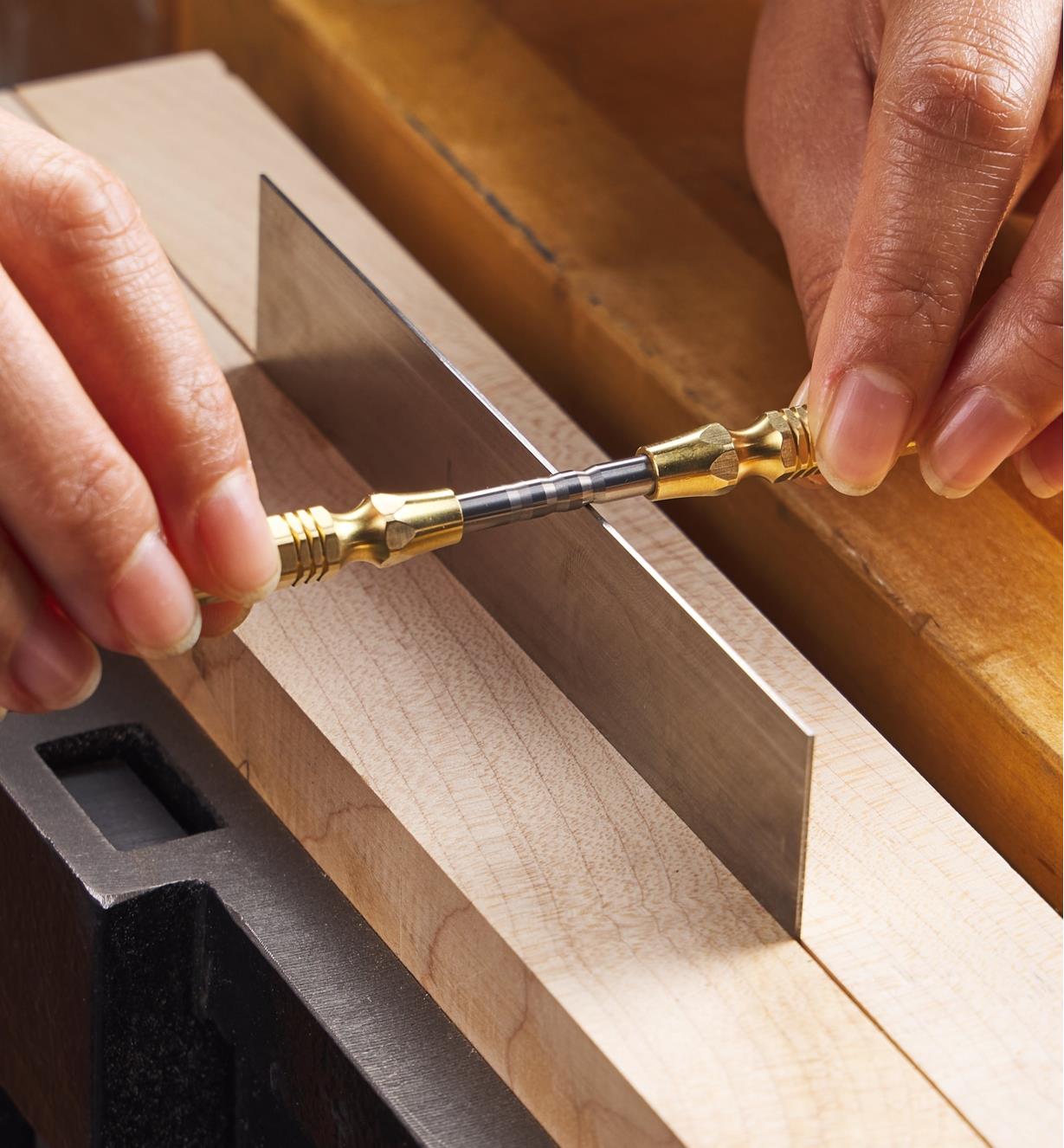 Using an Accu-Burr handled burnisher to roll 15° hooks on the edge of a scraper held in a vise