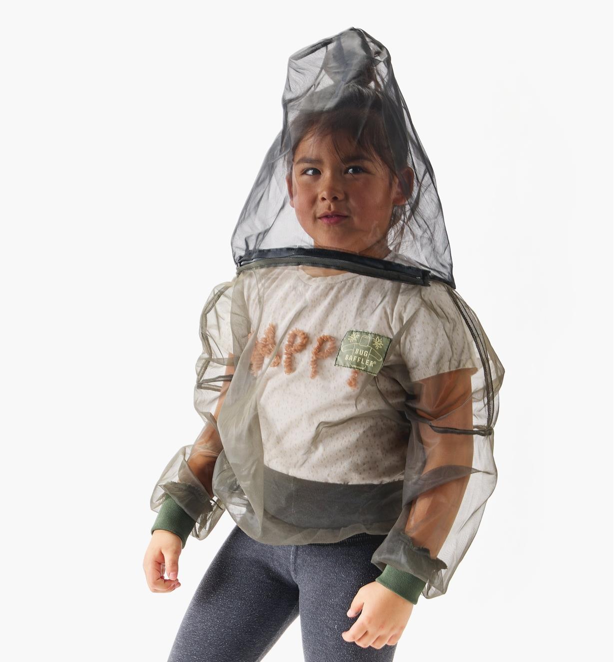 A child wears a hooded bug-protection shirt