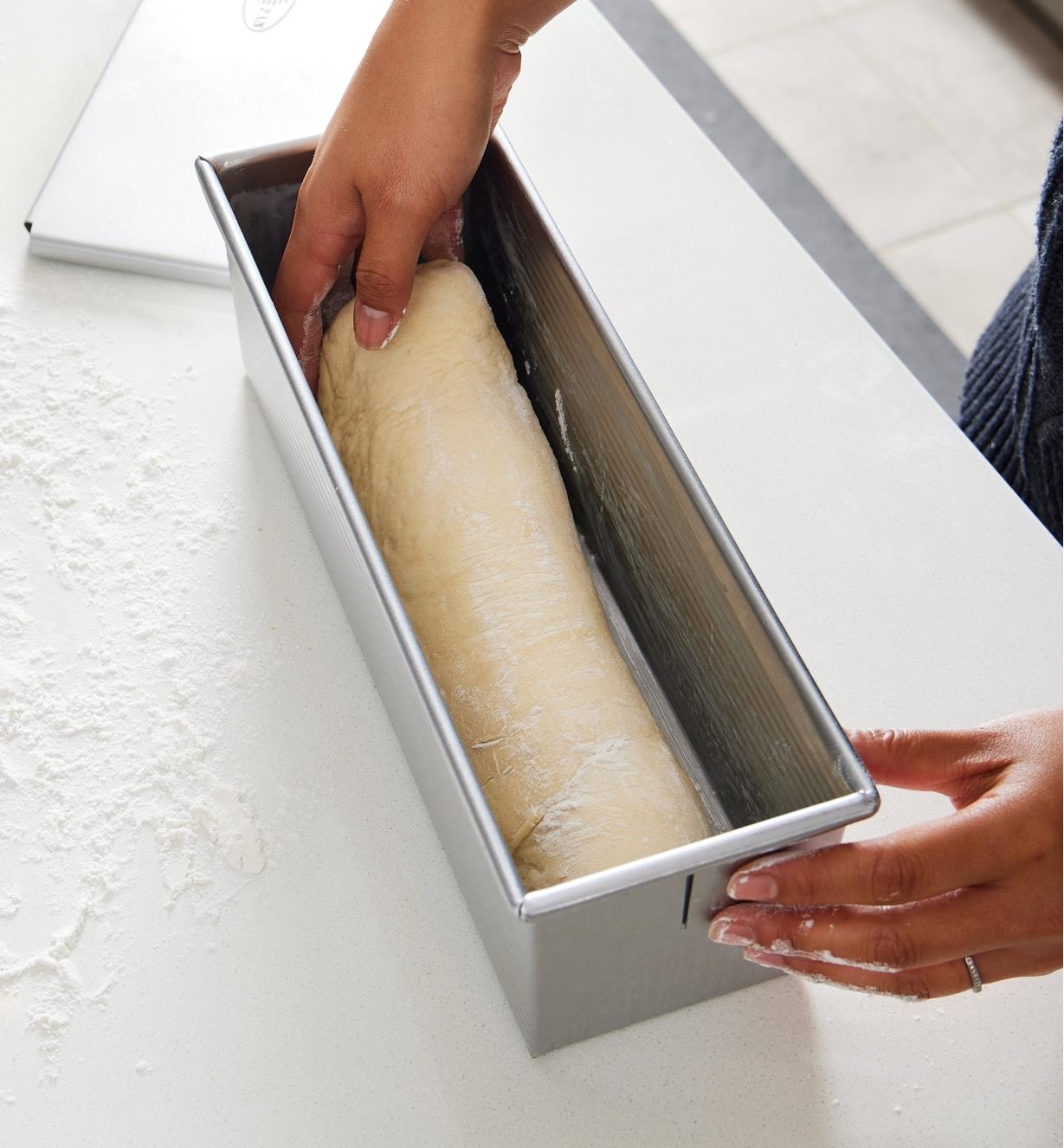 Placing bread dough in the Pullman loaf pan