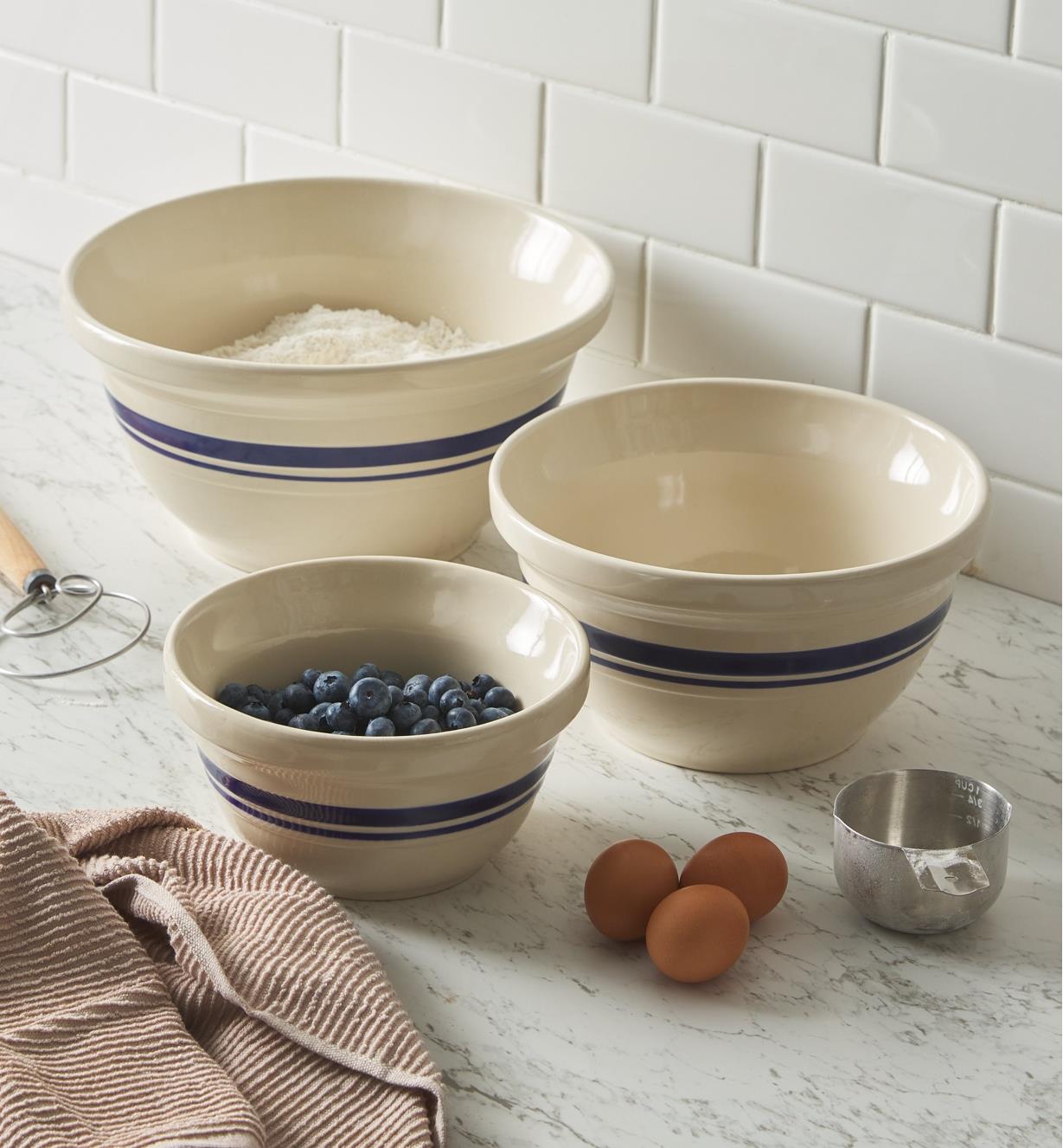 Set of three Dominion mixing bowls on a countertop with baking ingredients