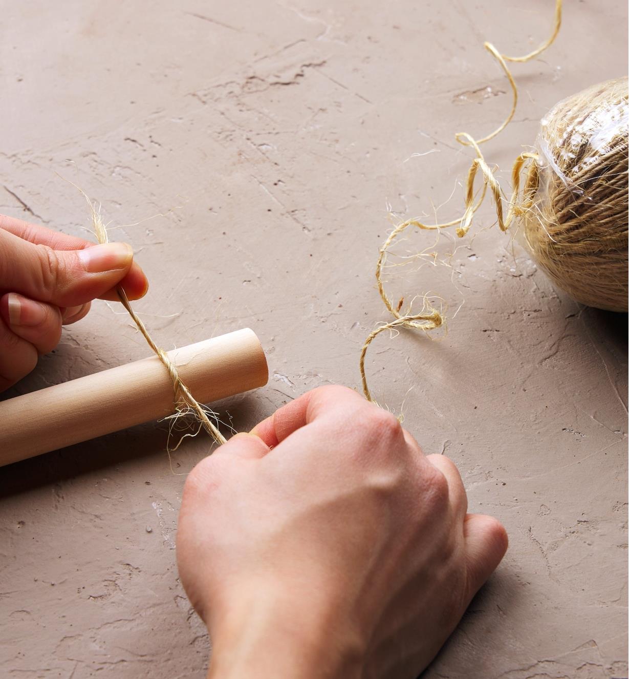 Making a herb drying rack with a piece of dowel and sisal twine