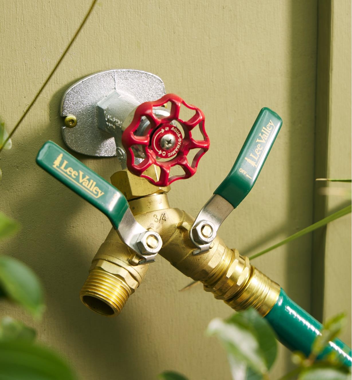 A Y shut-off valve on a faucet with a hose connected to one side