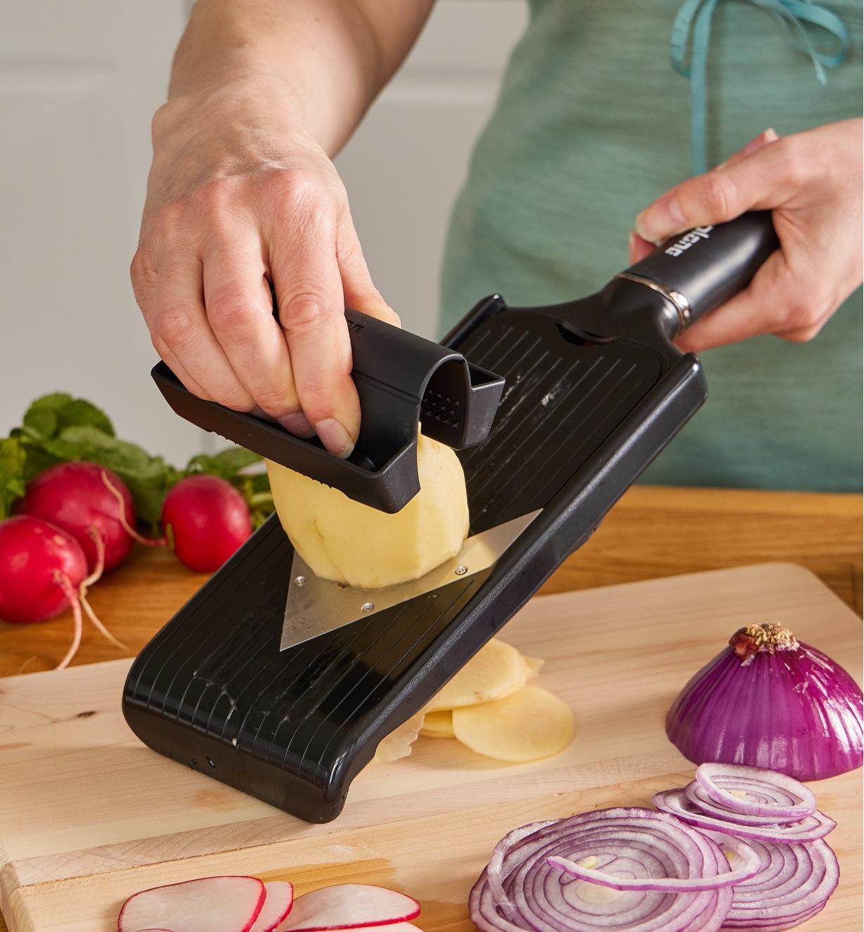 Slicing vegetables using the V-slicer with julienne blade