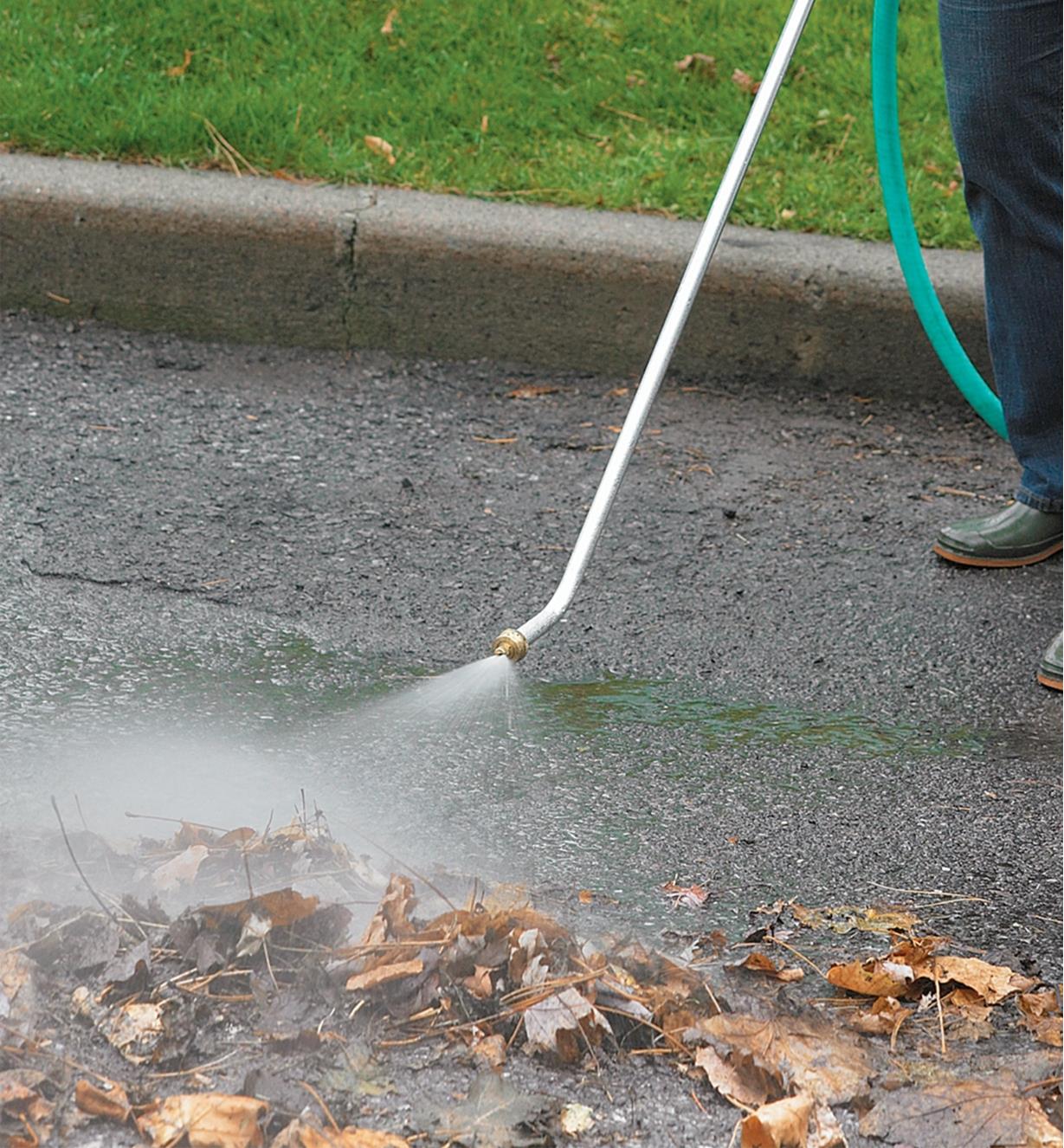 Using the Driveway Washer to clear leaves off pavement