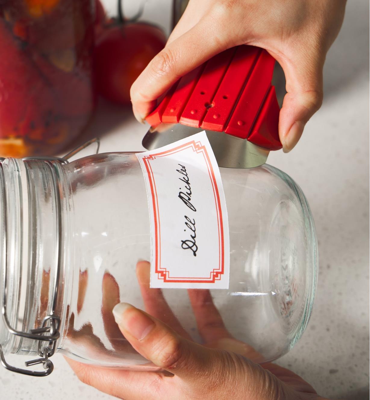 Using the regular scraper to remove a label from a jar