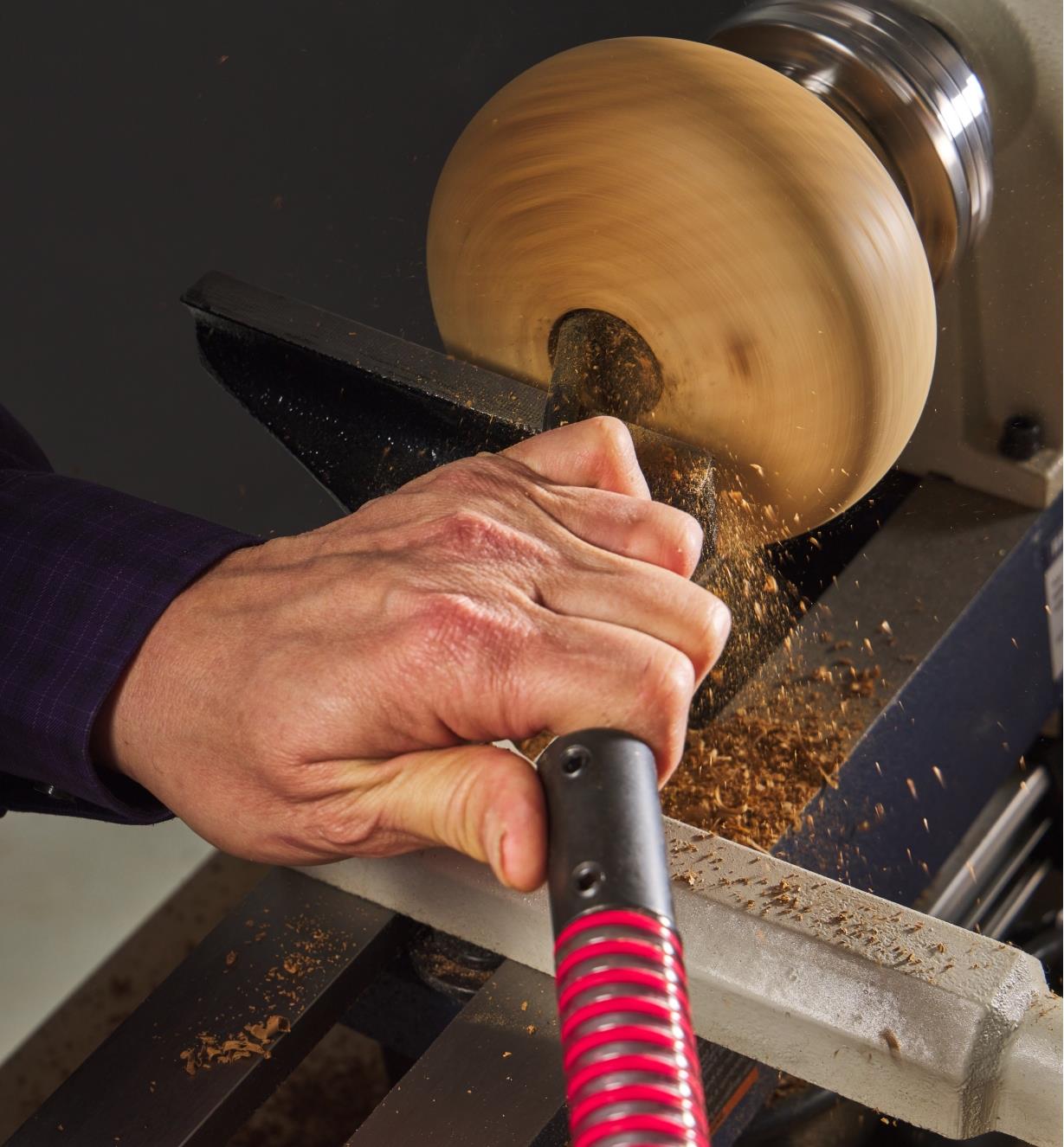 Wood is hollowed out on a lathe using a Kelton Hollower