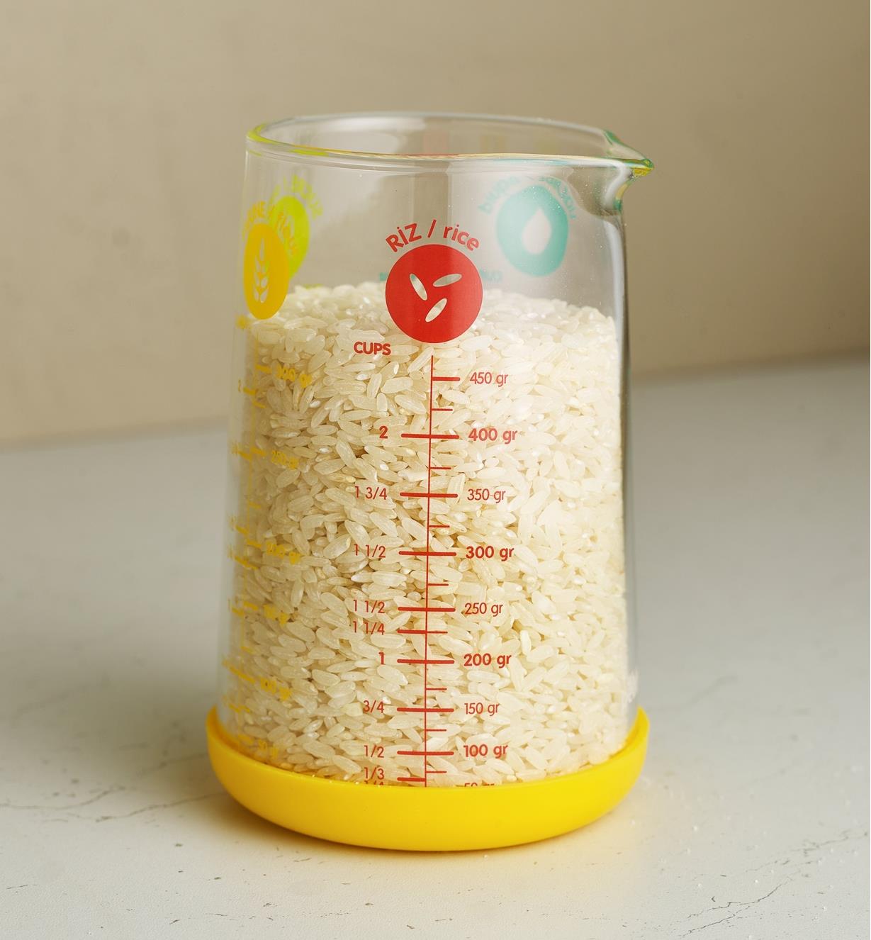 A measuring glass filled with rice
