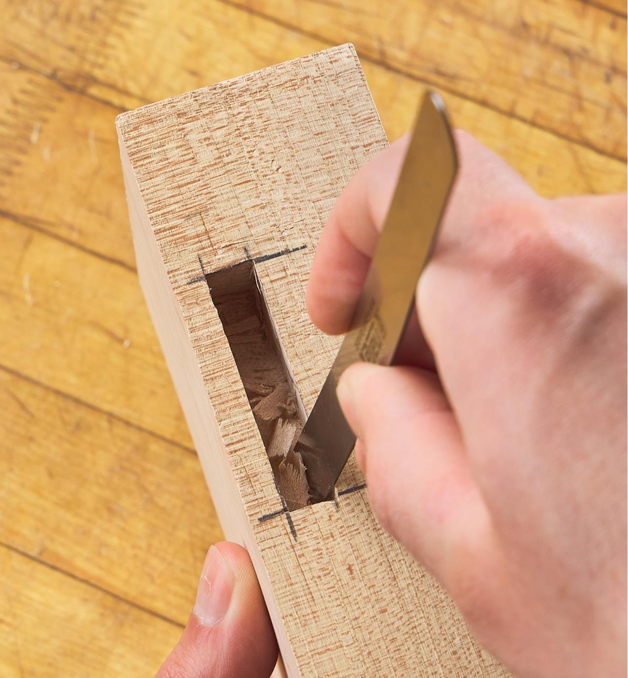 Scraping the walls of a right-angled mortise using the Narex uni-scraper