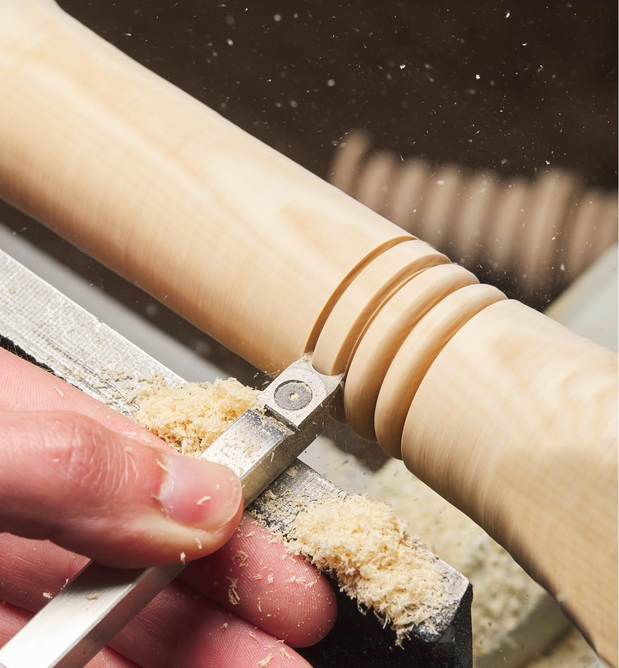 Turning beads on a wooden spindle using a negative-rake beading cutter