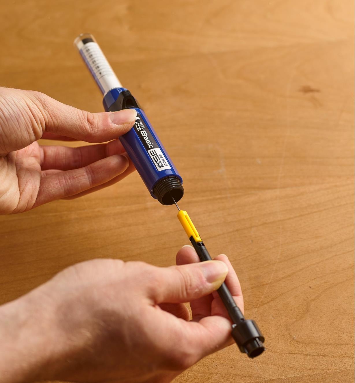 Inserting a base, holder and needle into a stud finder