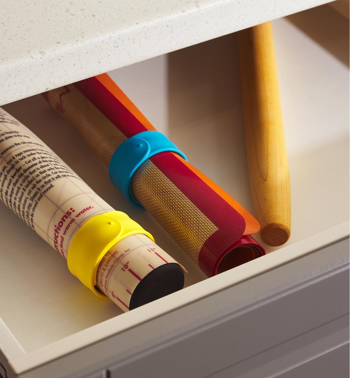 Slap bands used to keep rolled baking mats neatly bundled in a drawer