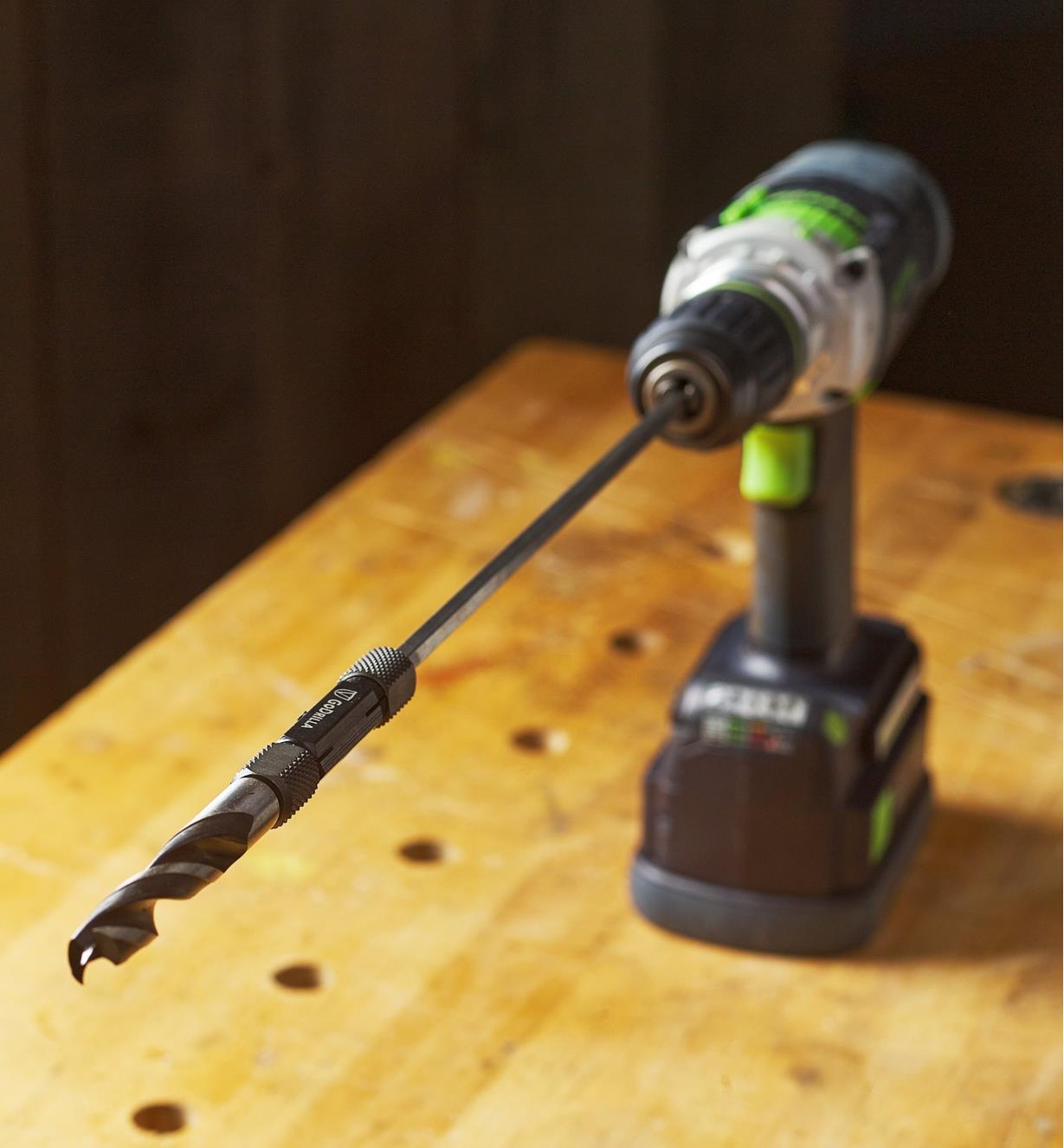 A GoDrilla and drill bit connected to a power drill