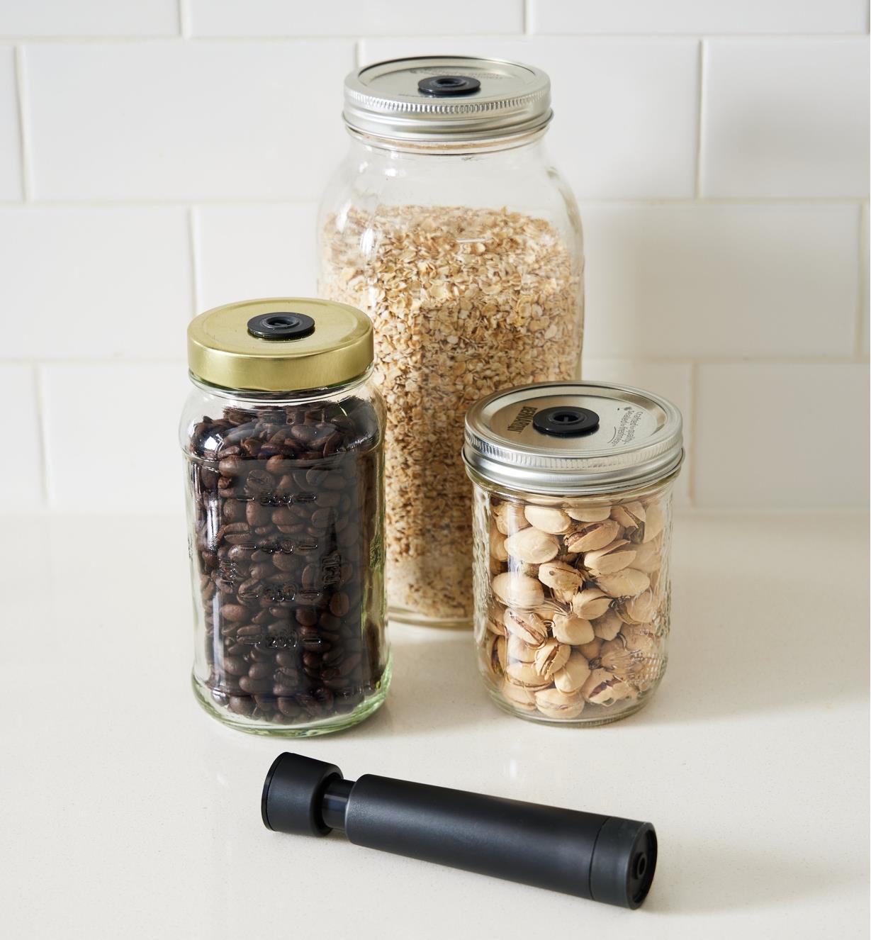 Coffee beans, oats and pistachio nuts stored in jars using the Airtender system