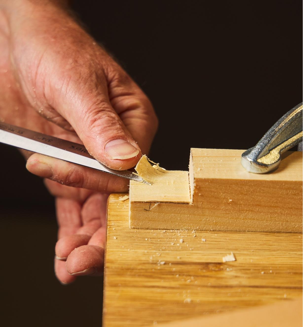 Chiselling out the waste on a tenon
