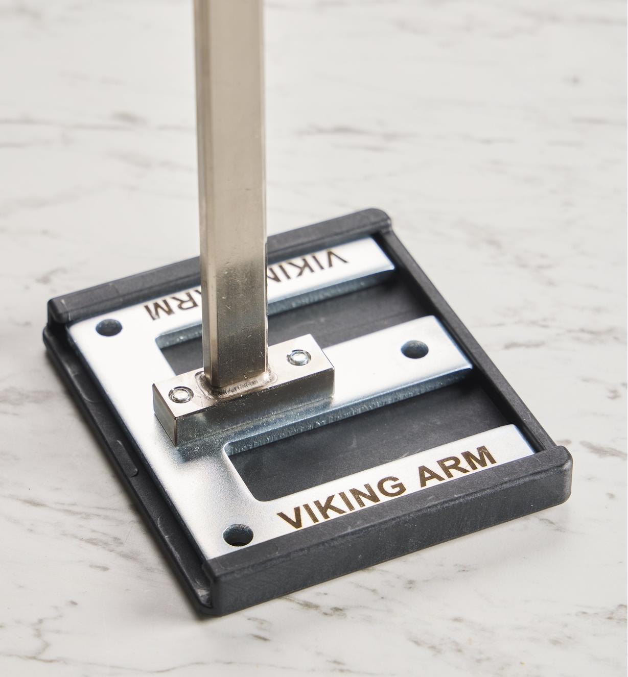 A top view of a base plate of a Viking Arm assembly jack with a base plate pad installed