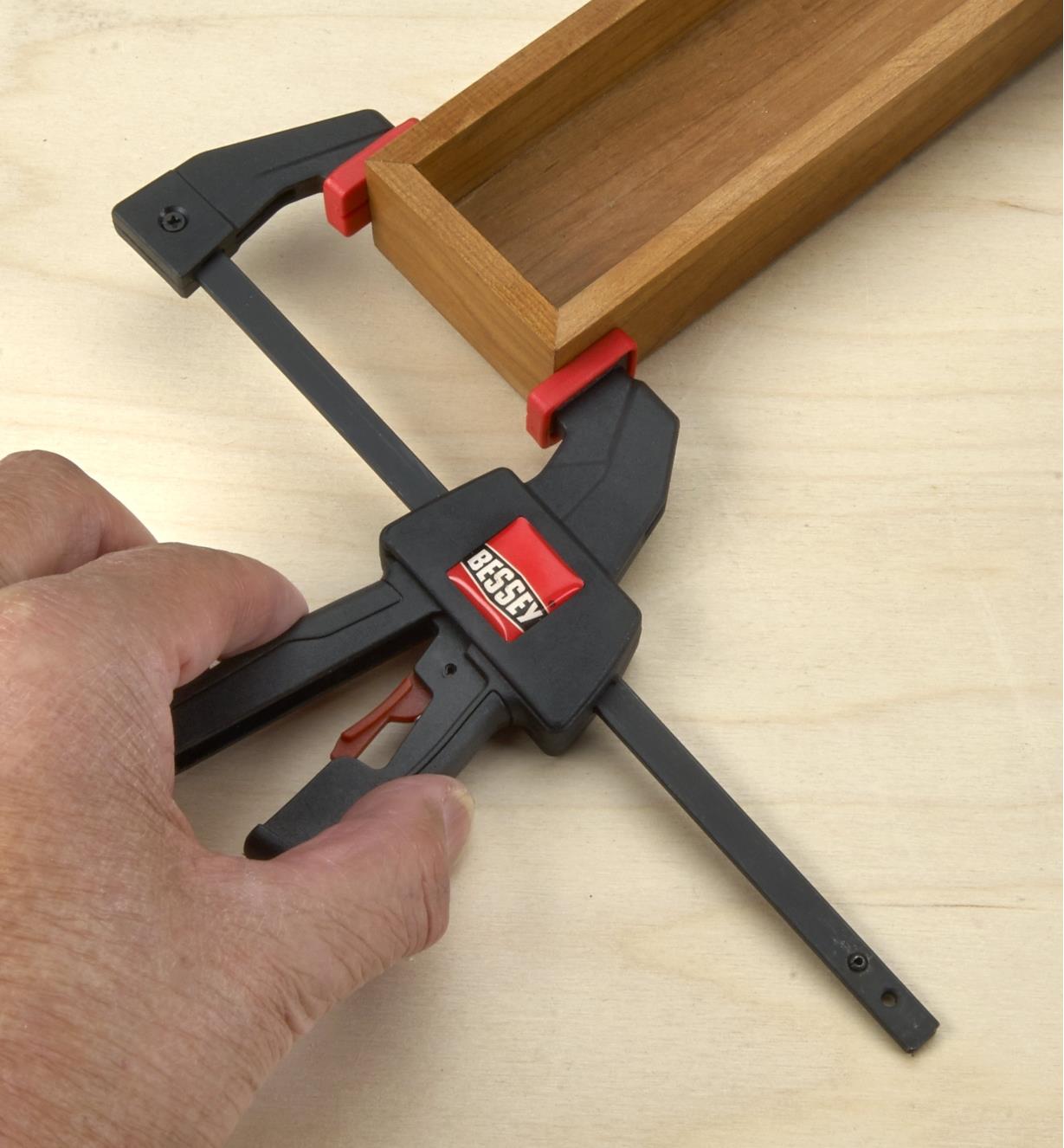 Using a micro-trigger clamp to clamp a rectangular wooden box