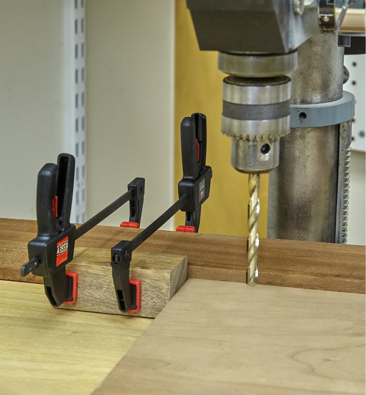 Using two micro-trigger clamps with a wooden block to create a stop block for use with a drill press