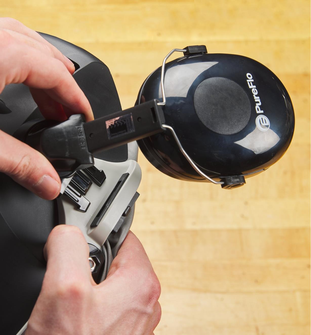 Attaching a hearing protector to the side of a Trend Airshield Pro full-face shield helmet