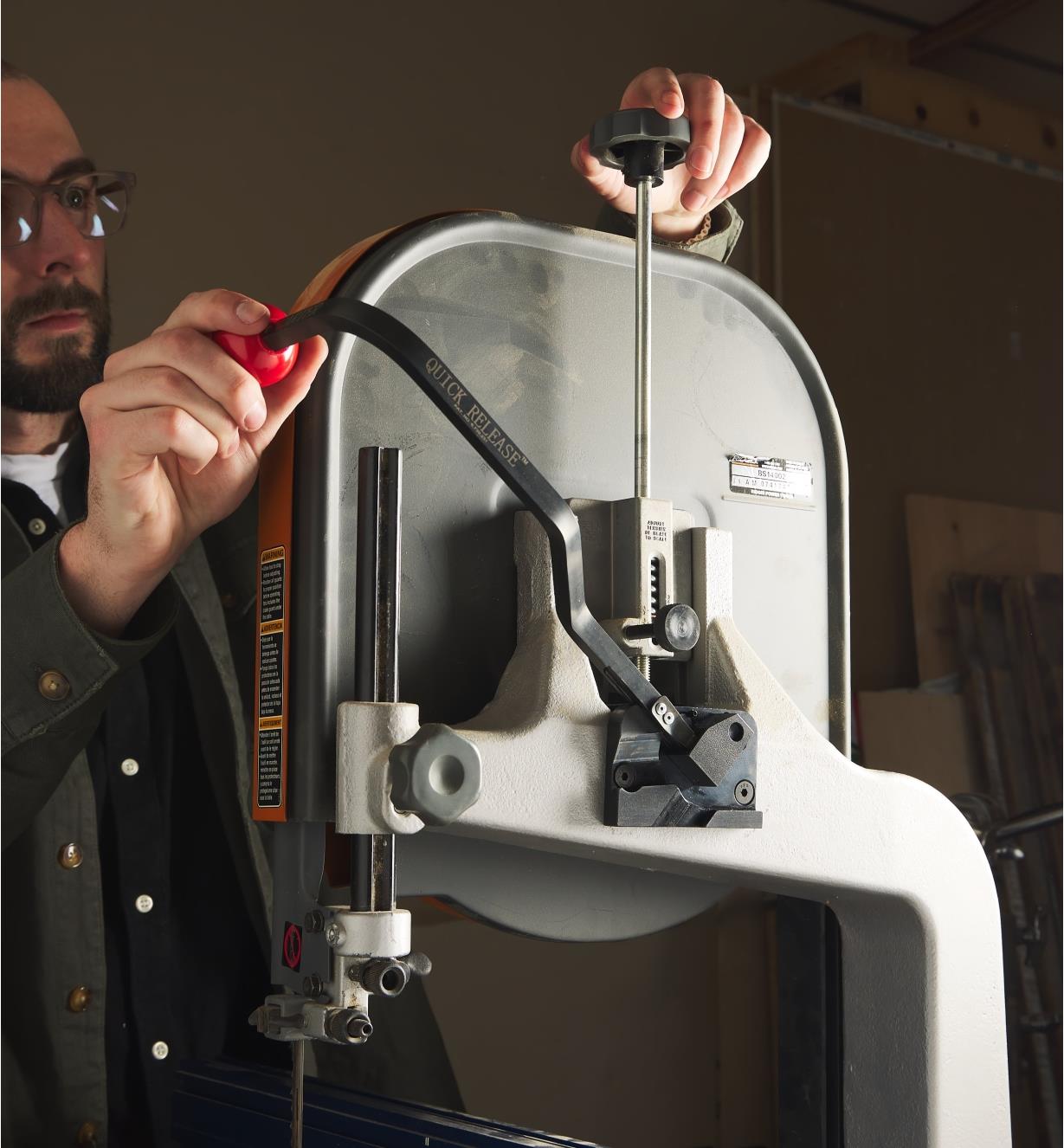 Lowering the Blade Quick-Release handle mounted on a bandsaw