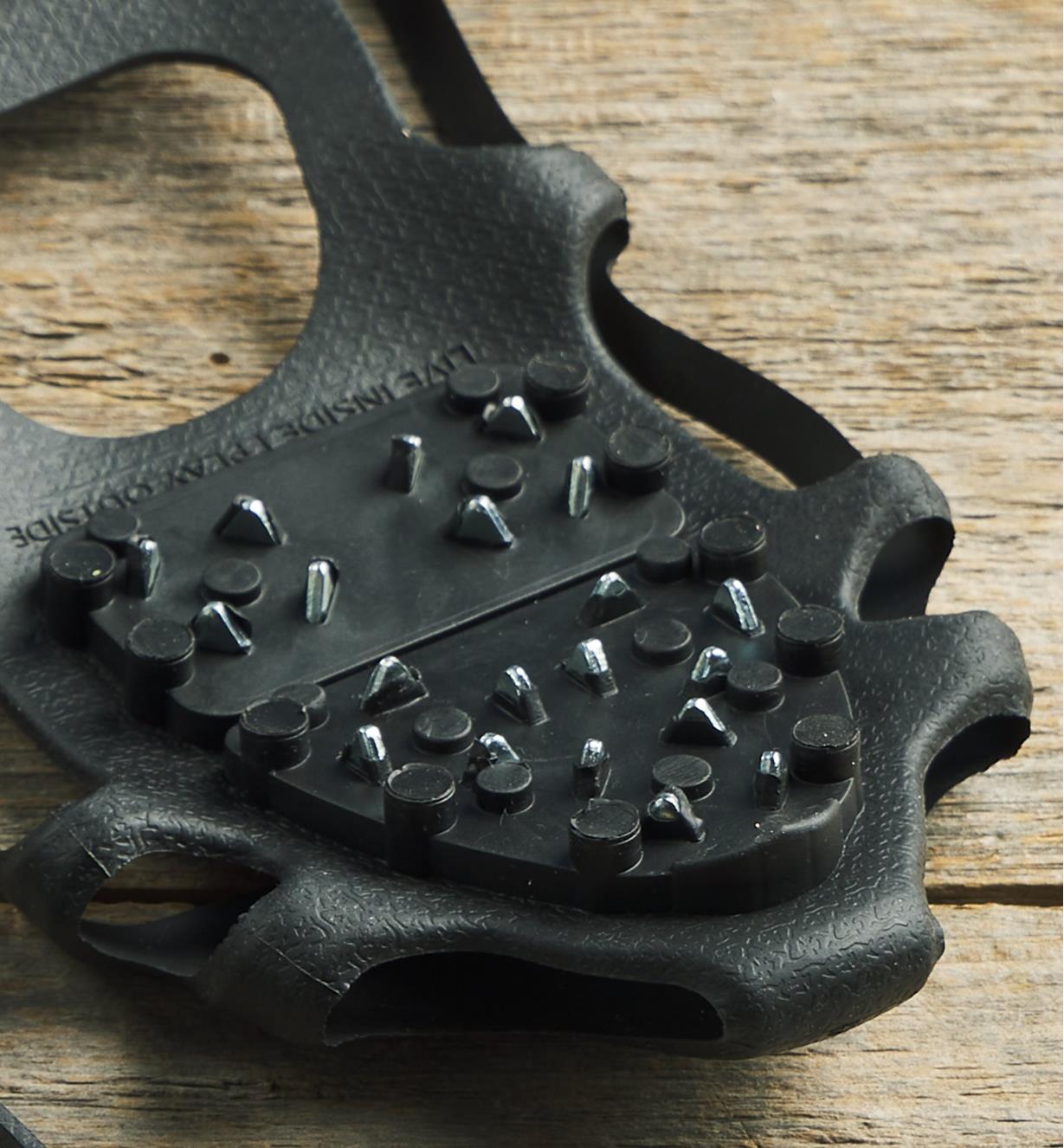 A close-up view of the bidirectional steel ice cleats