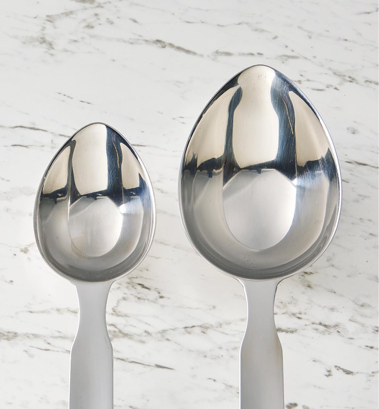 Two sizes of long-handled measuring scoop side by side