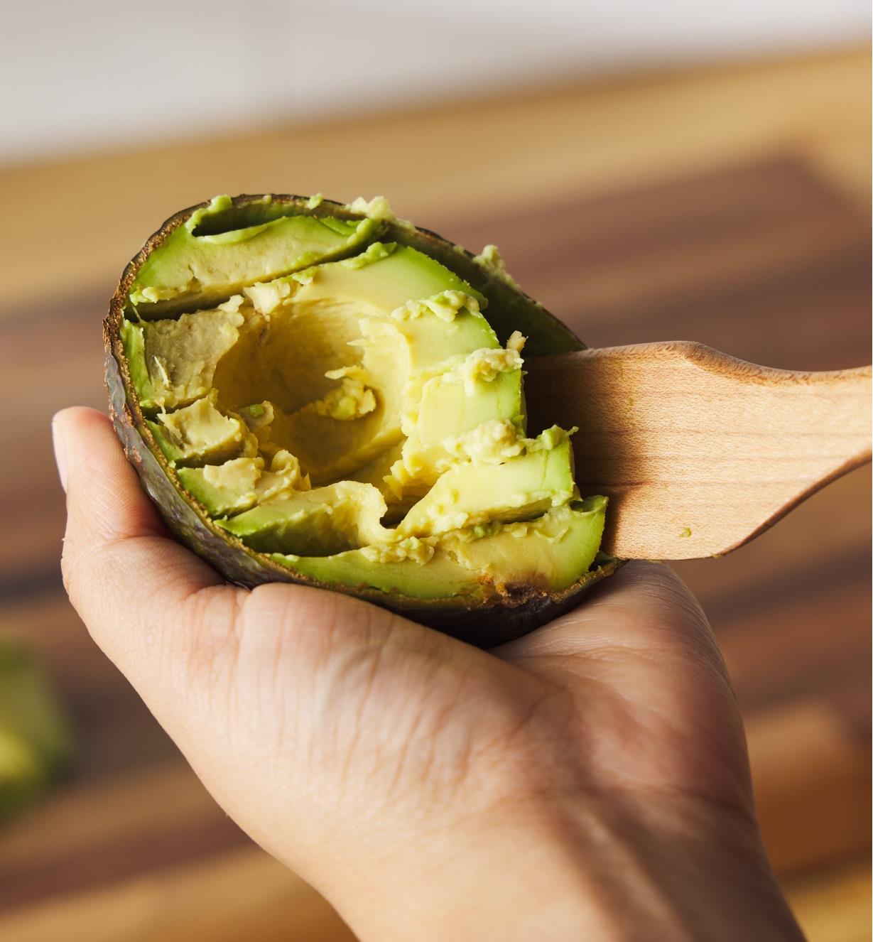 Using a Better Spreader to remove avocado from the skin
