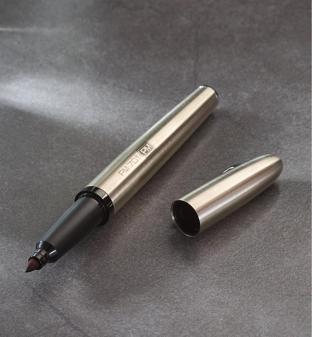The Stainless Steel Marker and its cap sit side by side on a flat surface