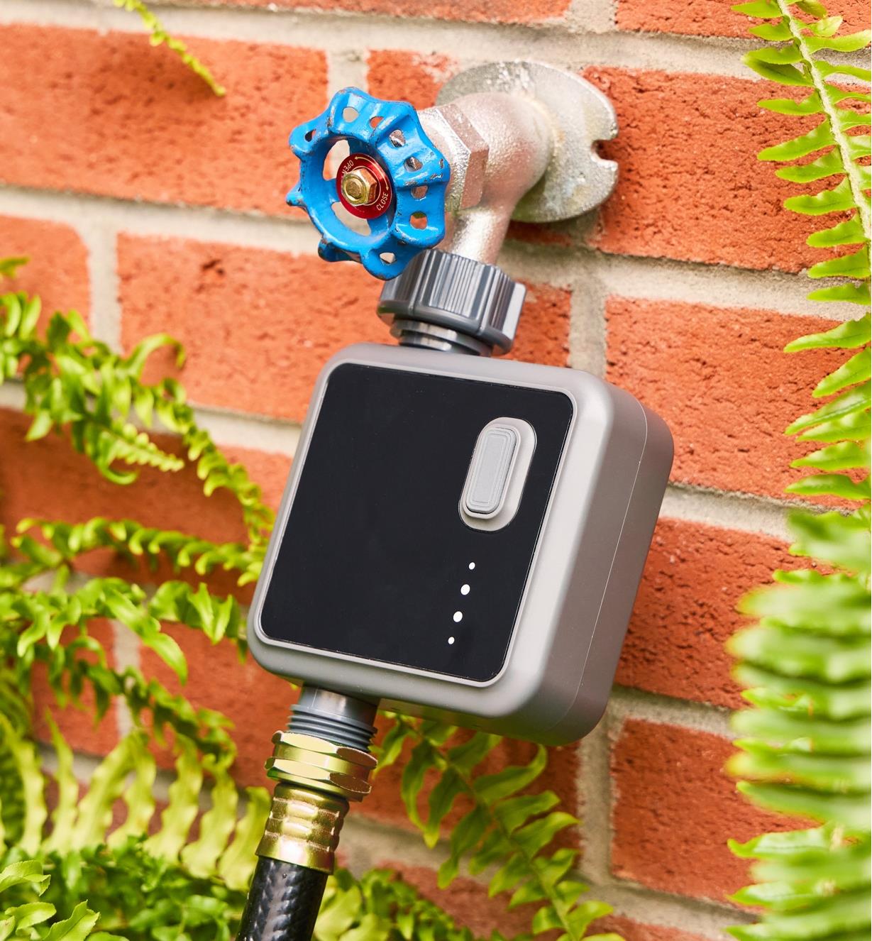 The Wi-Fi one-zone water timer connected to an outdoor tap