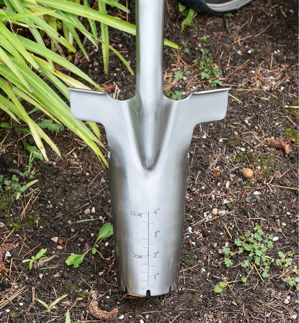 Close-up of the head of the bulb planter showing measurement markings