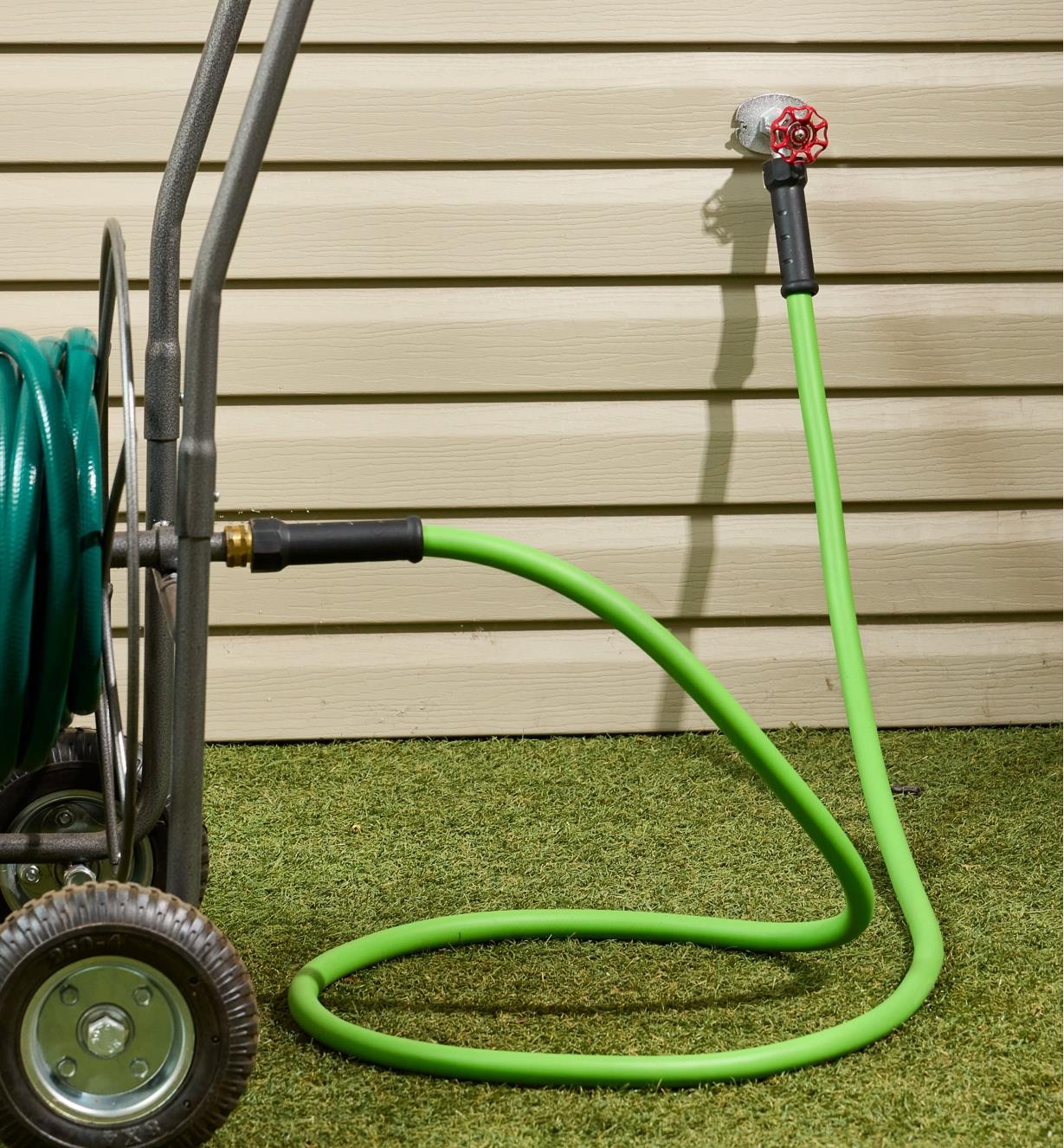 The 10’ leader hose connected to an outdoor tap on one end and a longer hose on a reel on the other end