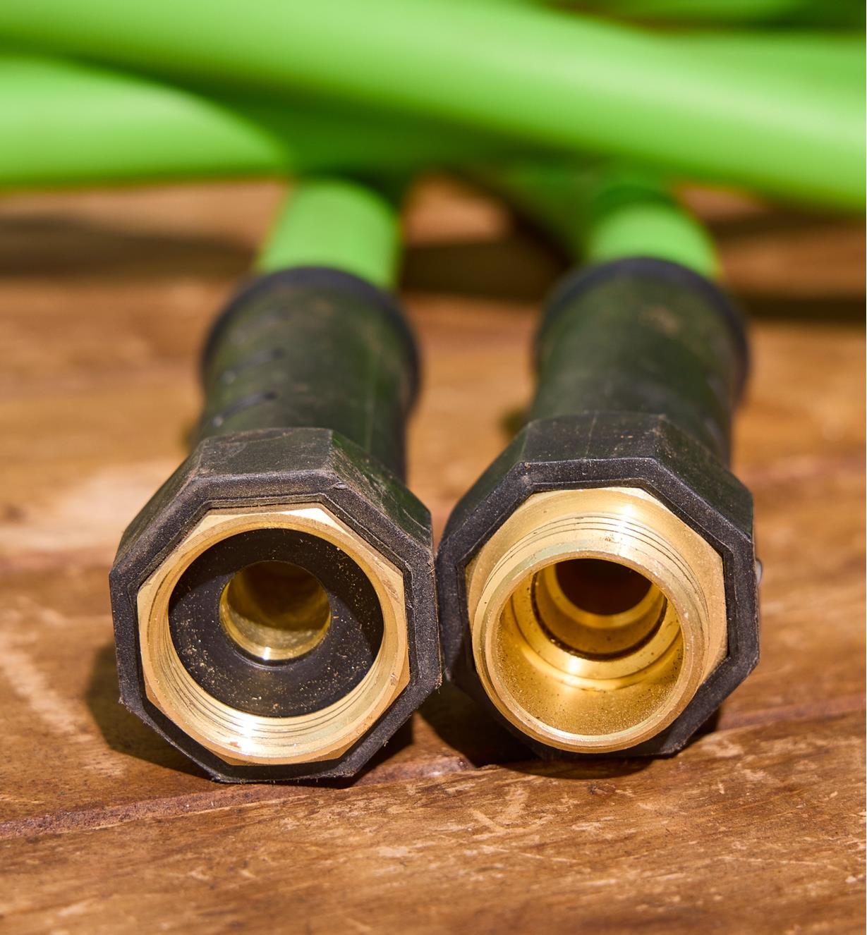 The ends of the hose with plastic swivel collars and brass fittings