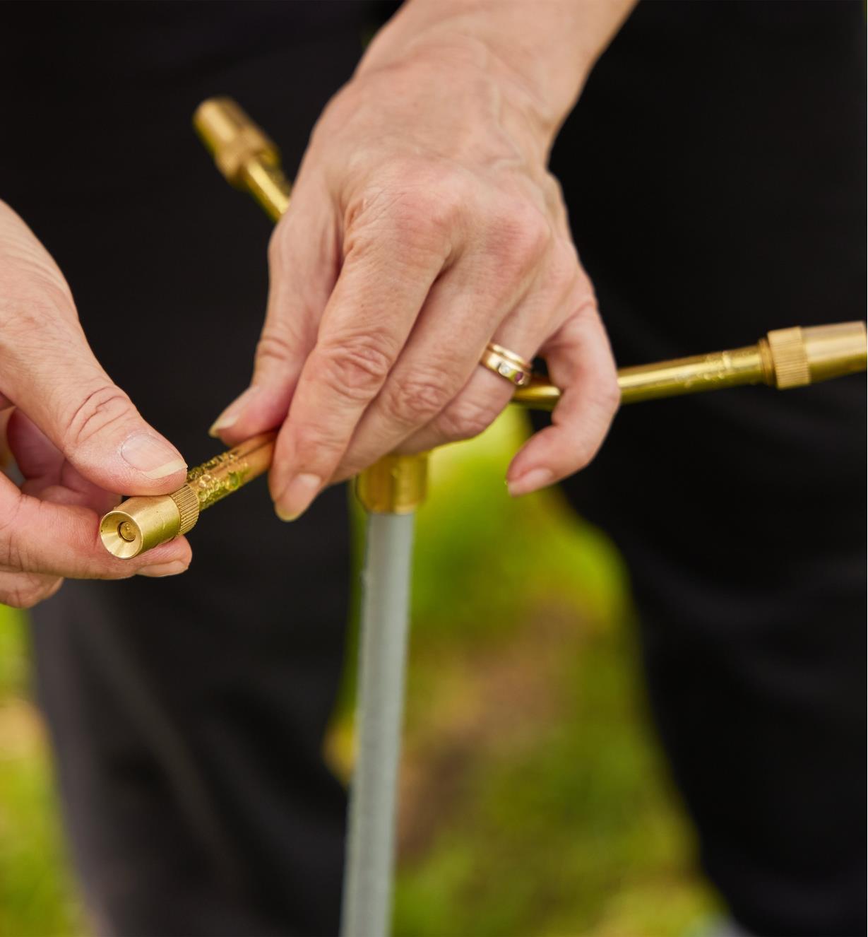 Adjusting a nozzle on a telescoping sprinkler