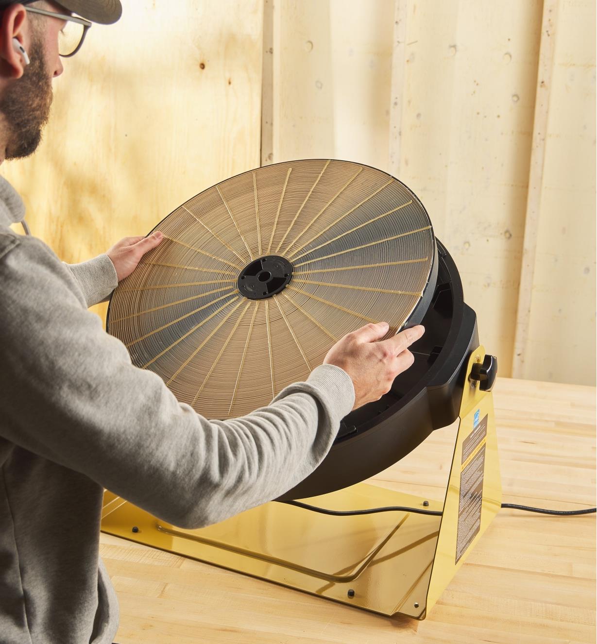 A replacement inner micro dust filter being placed into an air filtration system