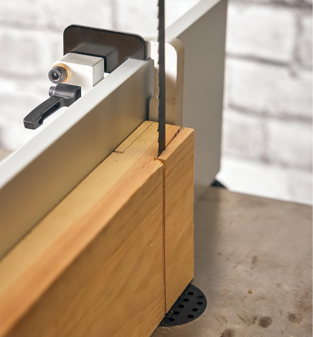 Cutting a tenon cheek on a bandsaw, using a flip stop on a DX3 Driftmaster fence to limit the cut