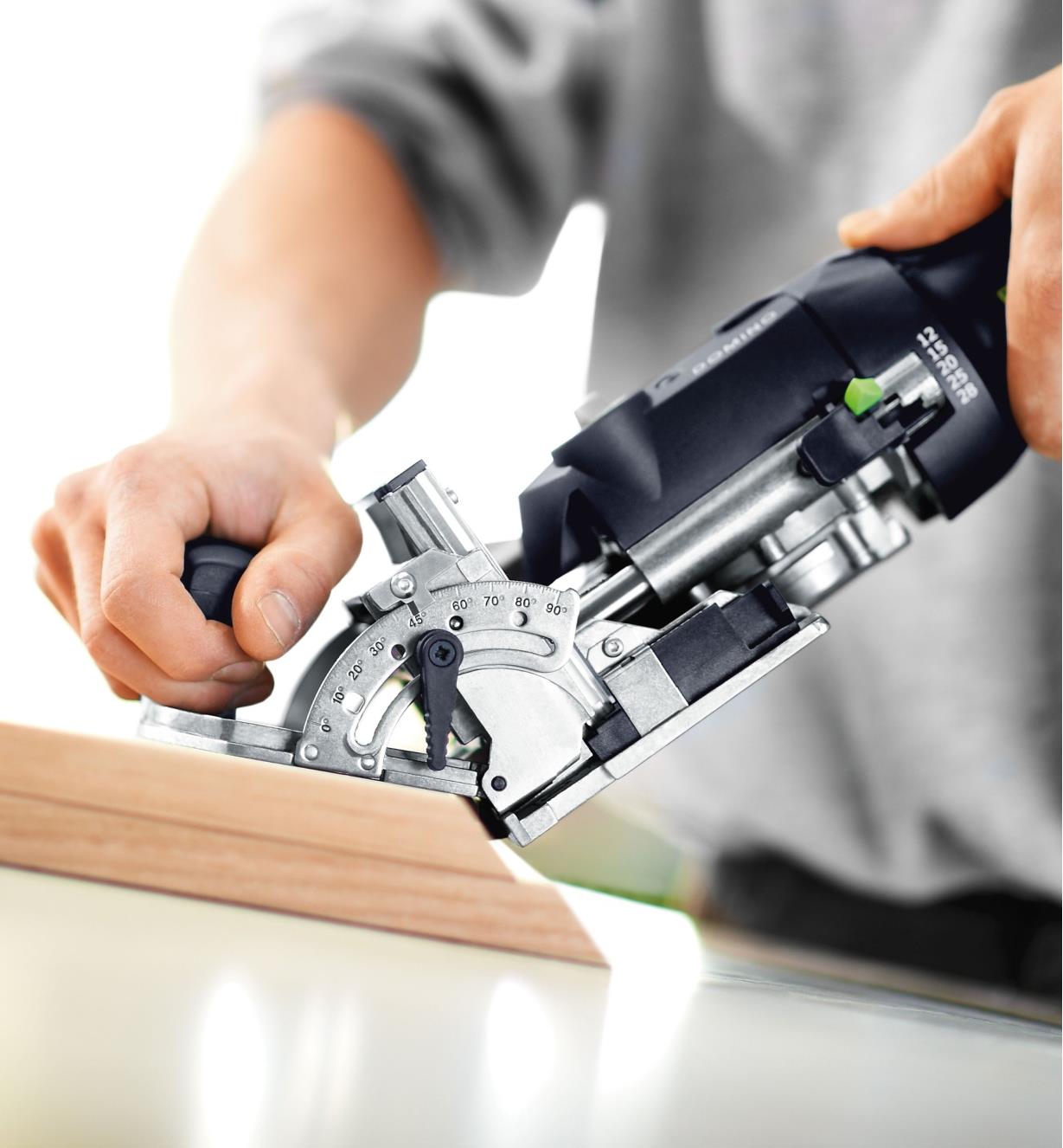 Cutting Domino mortises into a miter joint, using the fence set to 45 degrees