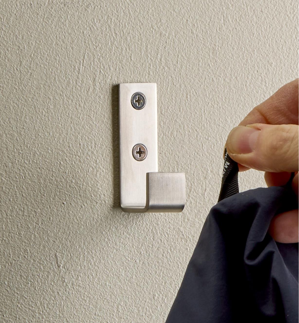 Hanging an article of clothing on a stainless-steel single utility hook